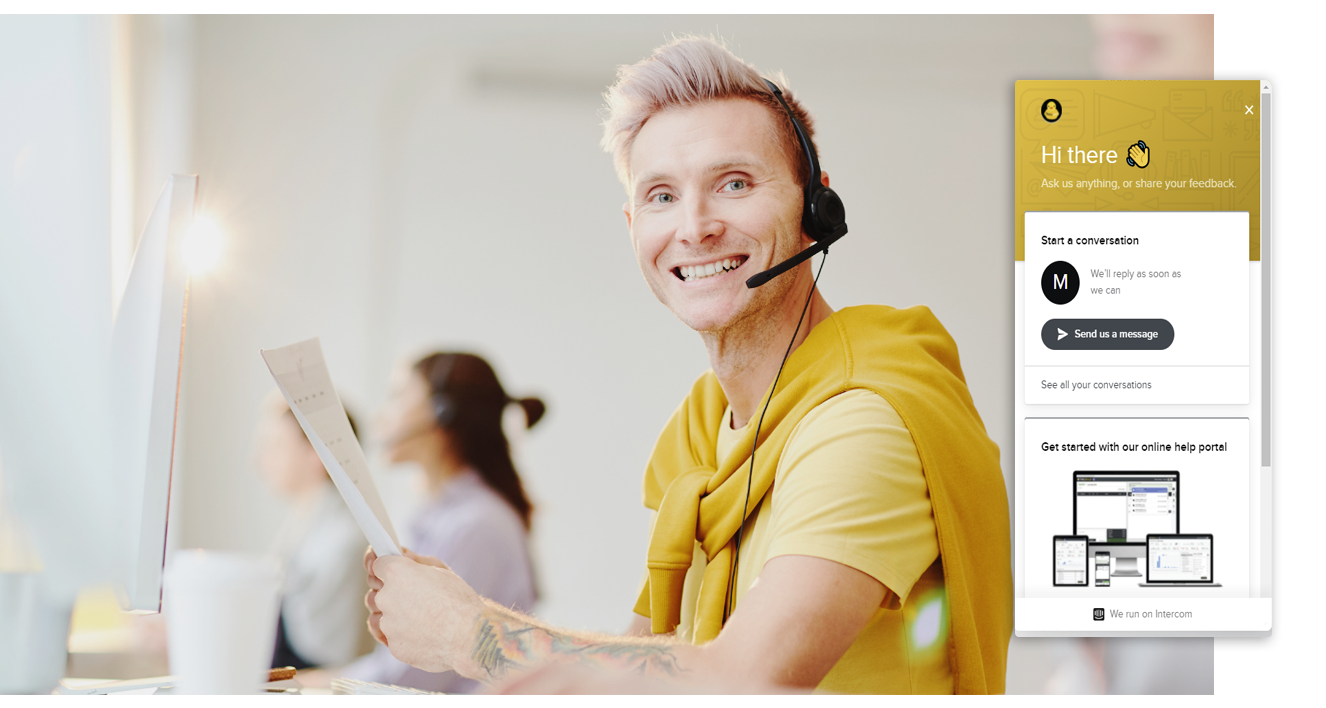 Male customer support worker smiling with TAKU help Dialog