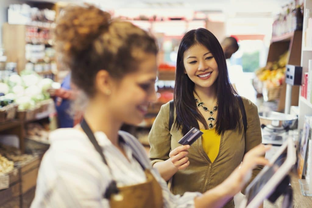 Women paying in store with credit card