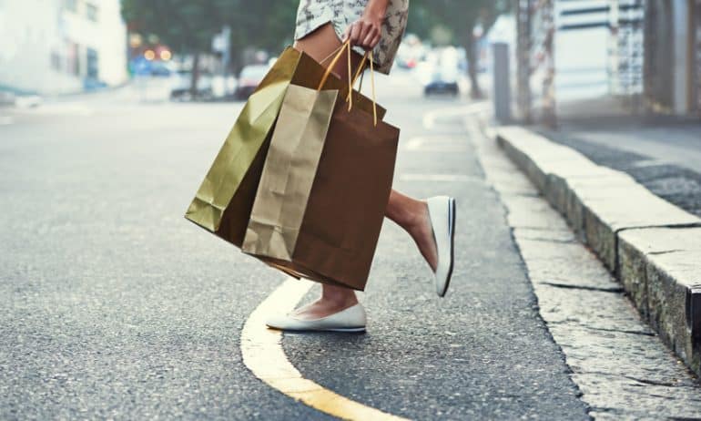 Customer by curbside with bags