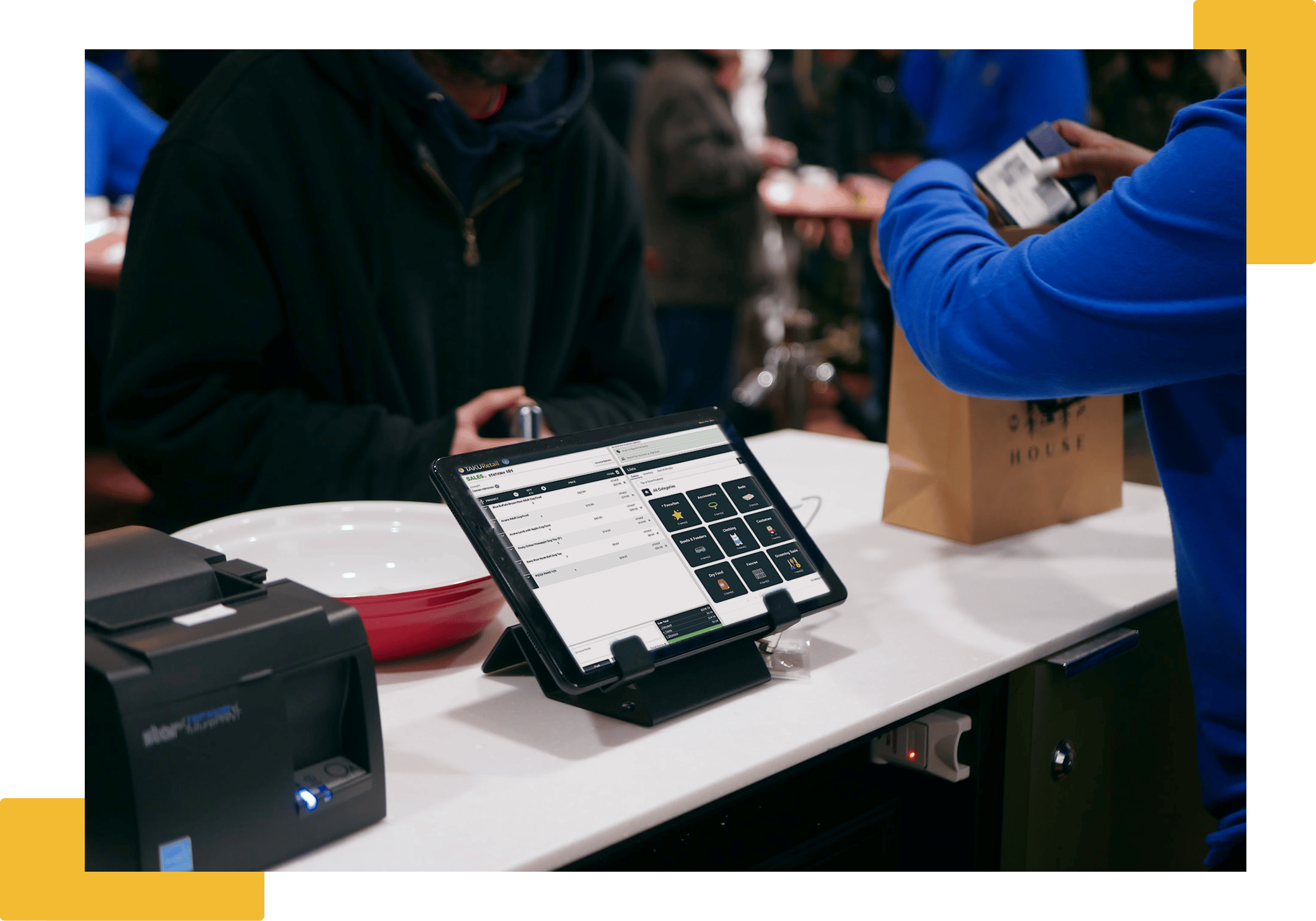 Cashier using TAKU Retail